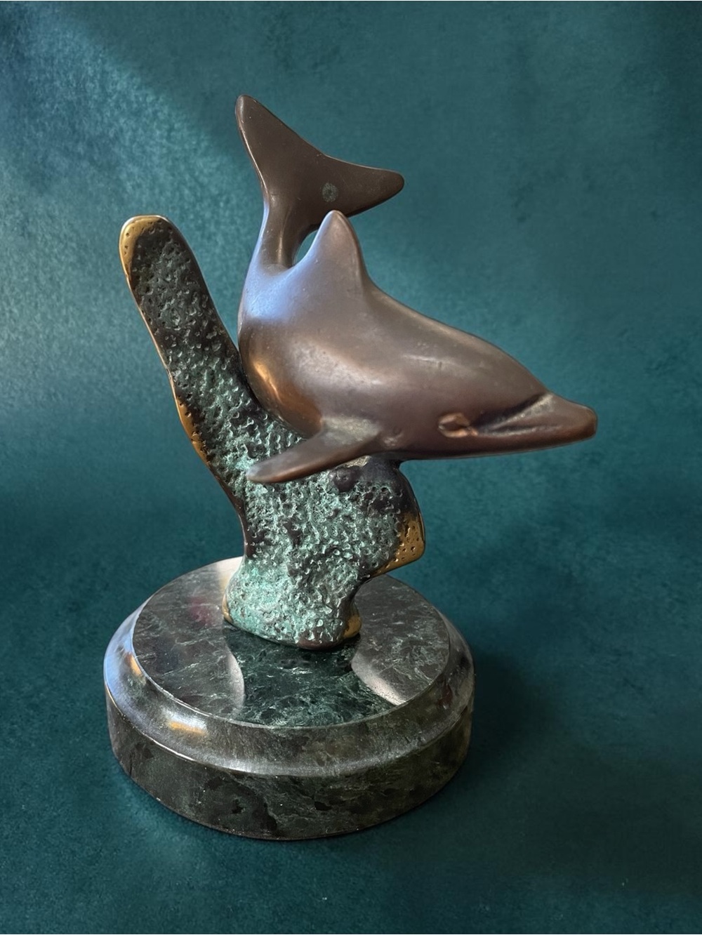 Bronze and marble dolphin statue. Some areas of corrosion, but still charming